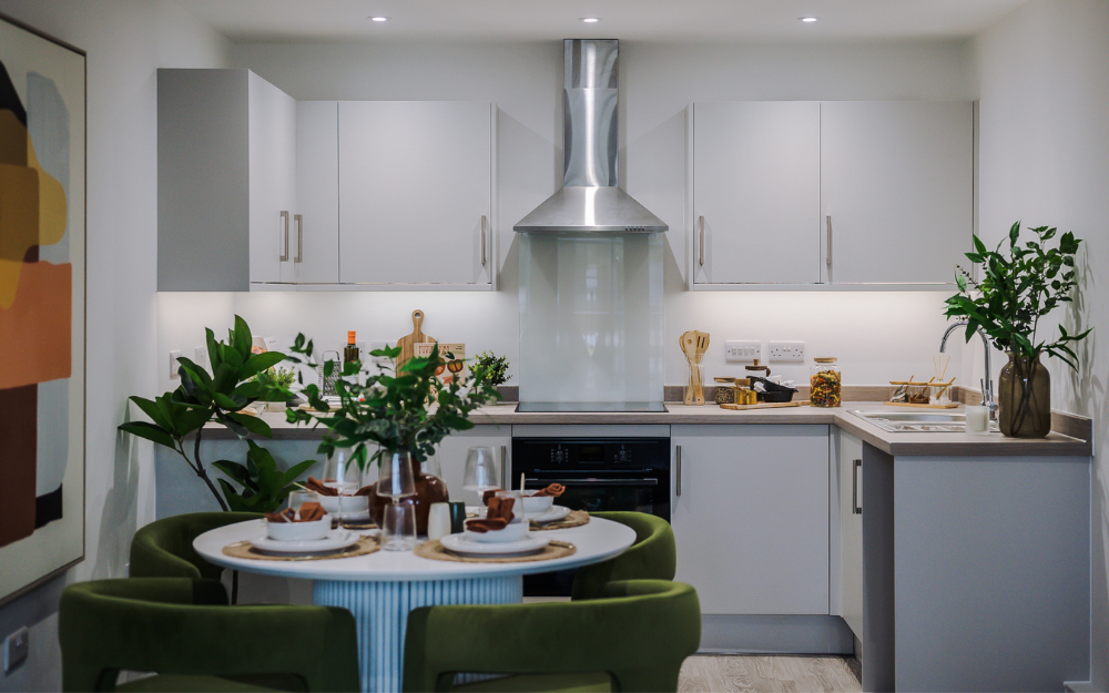 Pearson Place apartments are turn key ready. The show home has a stunning kitchen area with white goods included and an inviting table set for dinner...